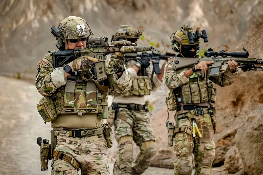 US Army soldiers in combat gear during infantry training exercise outdoors