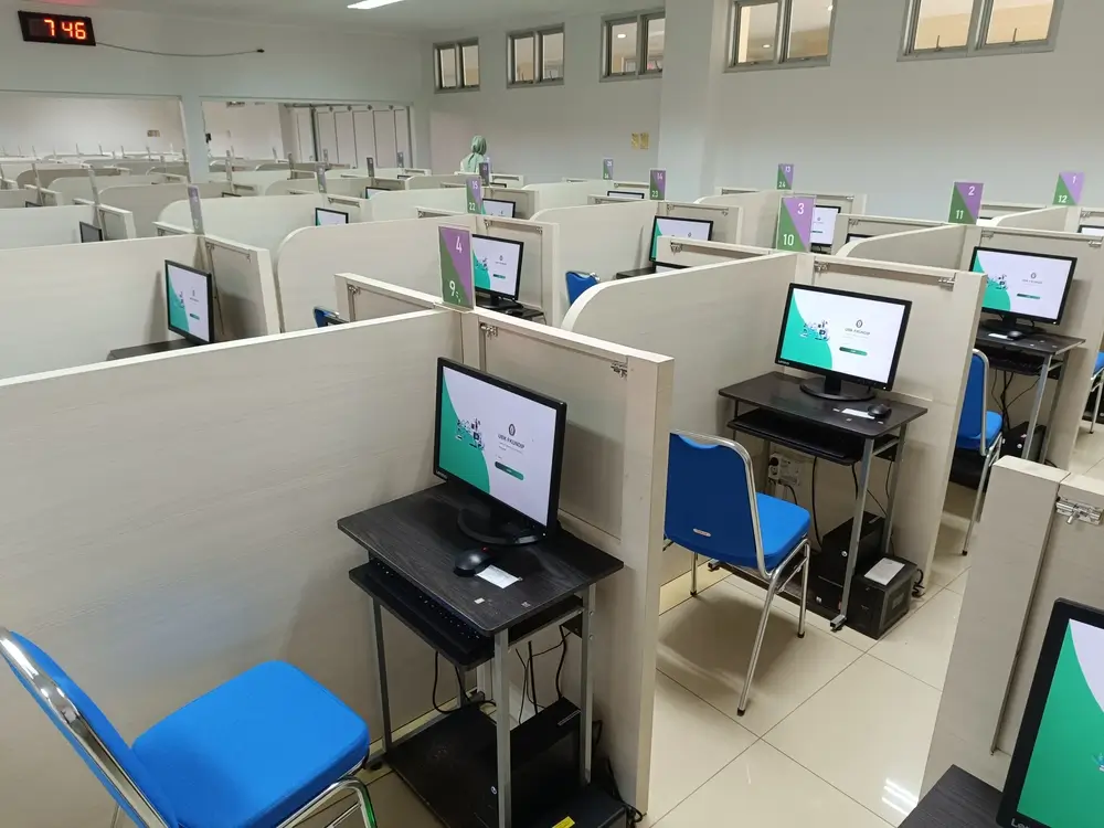 Student reading on a computer screen during a timed exam in a testing center
