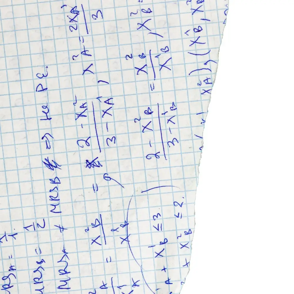 Handwritten algebra equations on a torn piece of graph paper used as a student studying scratch paper for math review.