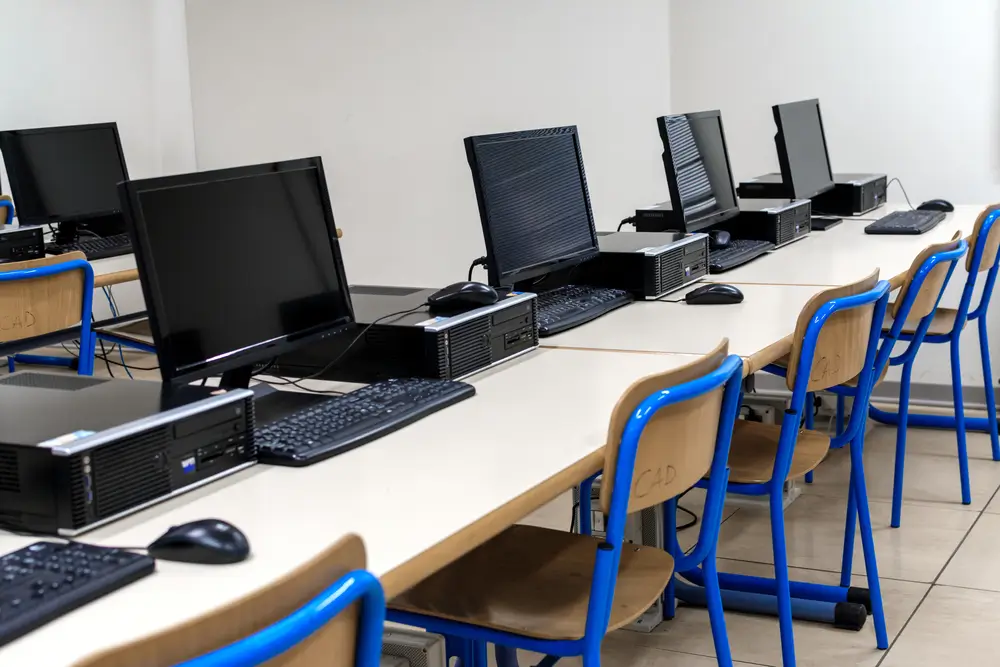 Young adult civilian taking a computerized military aptitude test at a MEPS testing station